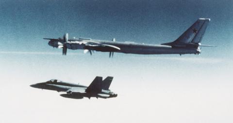 Canadian CF-18 Hornet escorts Soviet Tupolev Tu-95 in 1987. Photo: U.S. Navy, Public domain, via Wikimedia Commons.